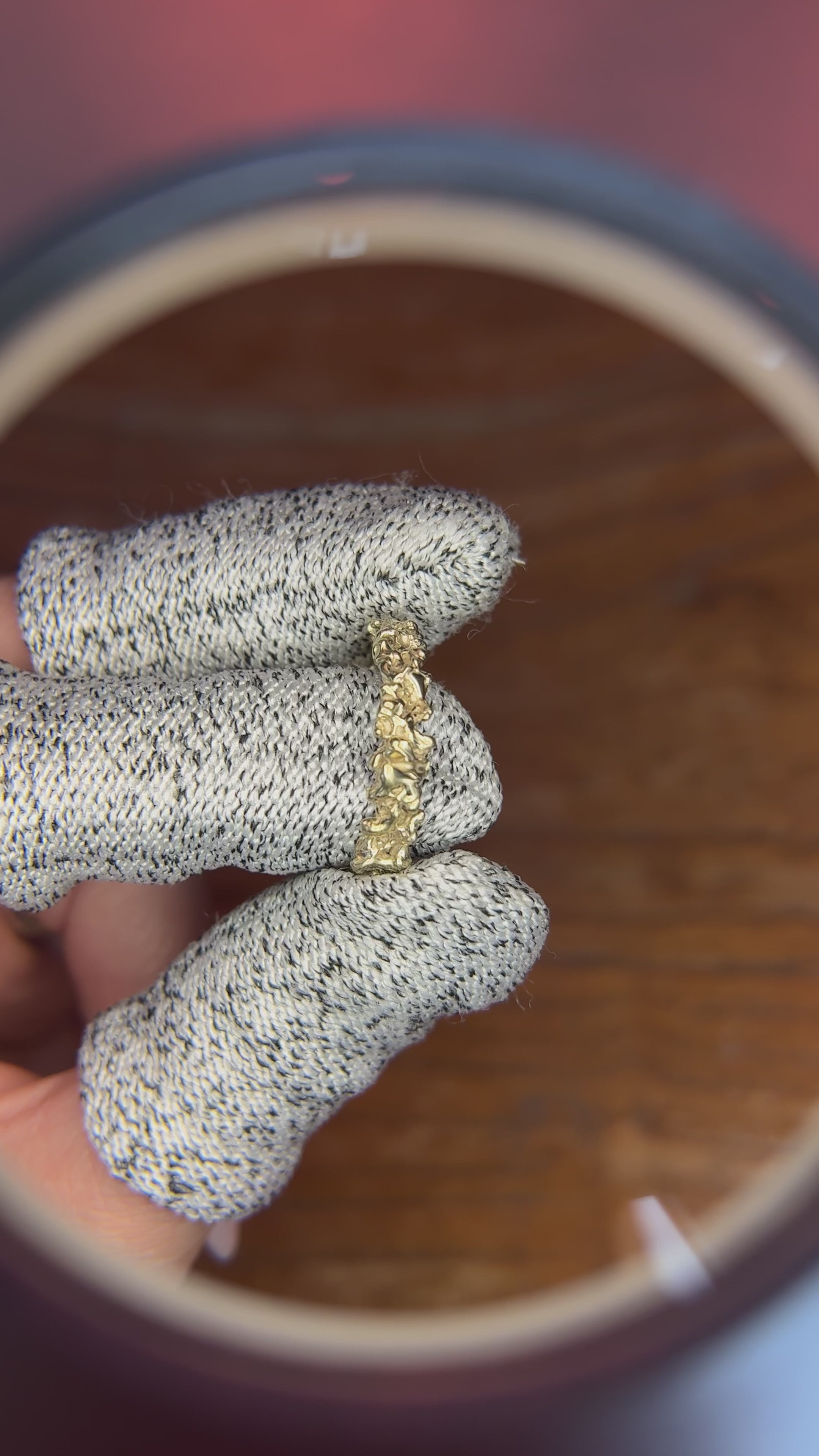 A spinning 14kt gold ring with a dense, textured surface, shown from all angles."